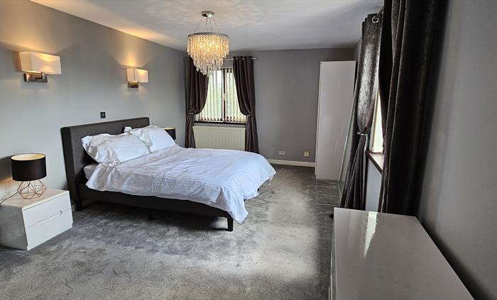 The Redford Cwtch Lounge – a cosy, welcoming space with soft seating, warm lighting, and rustic charm, perfect for relaxing with family or friends aft